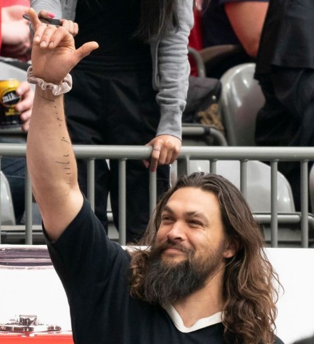 Jason waving at his fans.