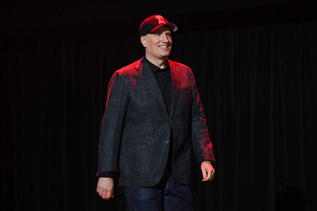 Kevin Feige walking on stage.