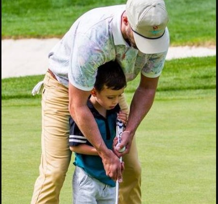 Timberlake golfing with his son.