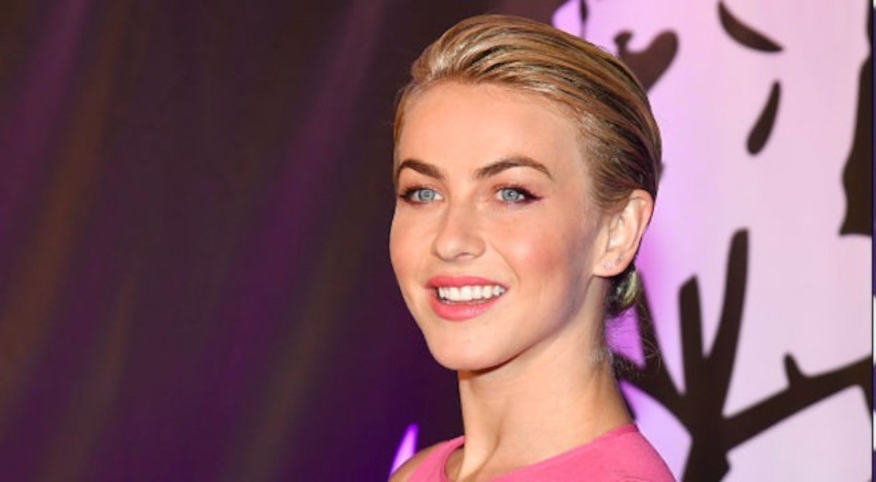 julianne with slick back bun in a pink dress 