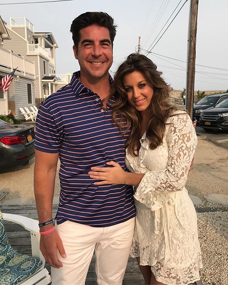 Emma DiGiovine cozying in to Watters in a white dress while both are smiling.