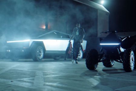 The car-centric video features include extensive shots of Travis using Cybertruck and electric ATV, Cyberquad. 