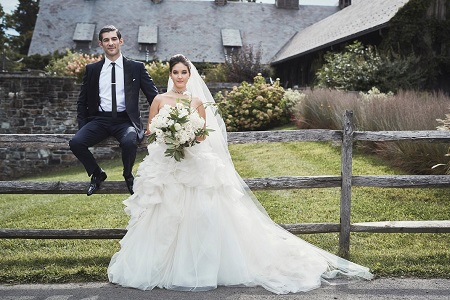 Alaia Baldwin is married to Andrew Aronow. Photo in their wedding dresses.