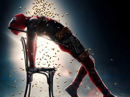 Deadpool mocks a popular music video as he arches forward and shell casings rains over him.