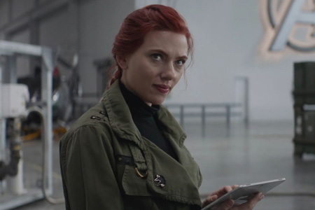 Natasha looks up from her tablet.