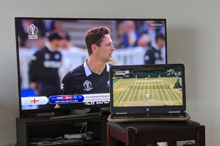 TV and laptop shows two different matches.