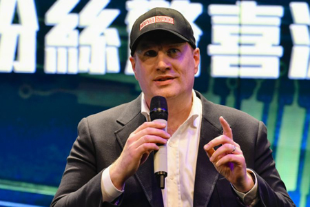 Kevin Feige on stage talking at a Marvel panel.