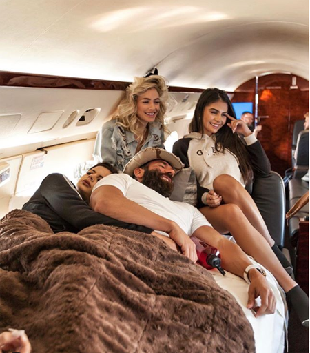 Dan Bilzerian in a private jet with some models.