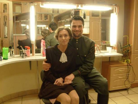 Danila and Urszula sitting inside a dressing room