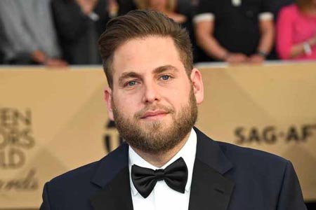 Jonah Hill with a bow-tie and suit.