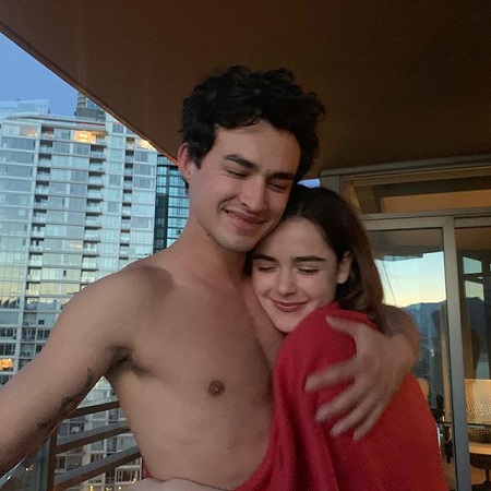 Gavin Leatherwood topless cuddling Kiernan Shipka in red.