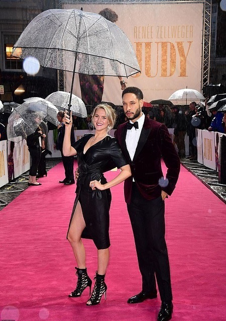 Pierreson's girlfriend also accompanied him to the European premiere of 'Judy'. She's holding a transparent plastic umbrella.