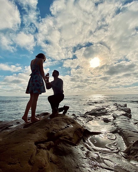 Wilmer Valderrama proposing Amanda Pacheco as described above.