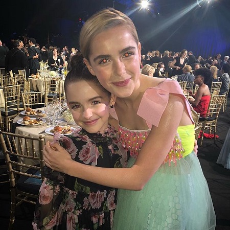 Kiernan Shipka Hugging her younger look-alike McKenna Grace.