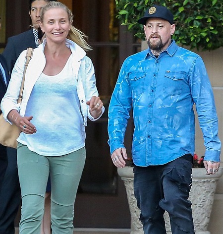 Cameron Diaz walking pregnant with husband, Benji Madden.