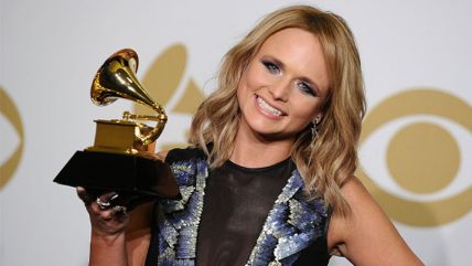 Miranda Lambert holding her Grammy high.