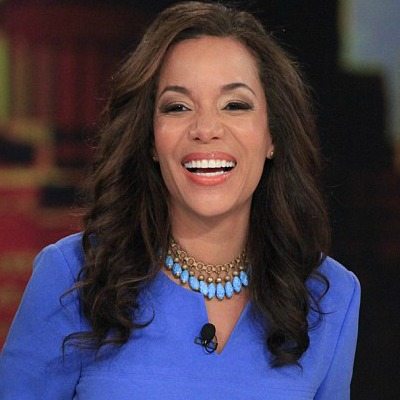 Sunny Hostin grinning.