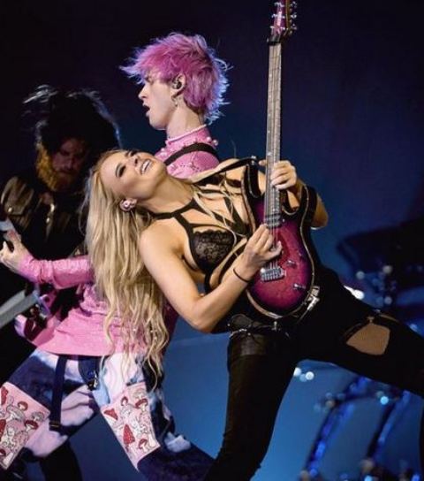 Machie Gun Kelly with his guitarist, Sophie Lloyd