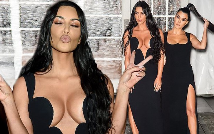 Kim and Kourtney Kardashian Display Extreme Cleavage in Glamourous Black Gowns As They Lead a Glittering Line-Up of Stars At amfAR Gala in New York