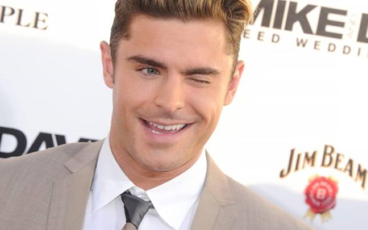 Zac Efron's New And Wild Beach Bum Facial Hair Was Genuinely Inspired By A Panini